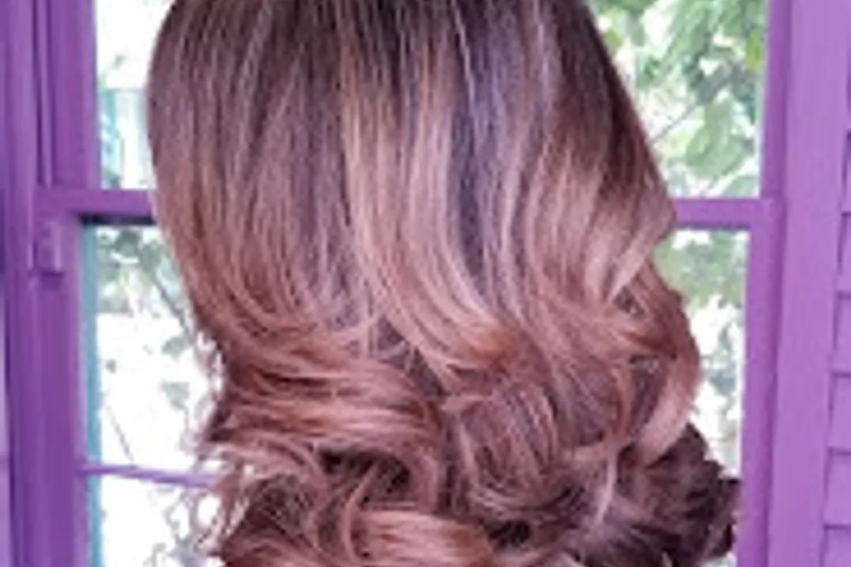 Brunette balayage with softly blended lighter ribbons and styled waves from the Chris David Salon gallery